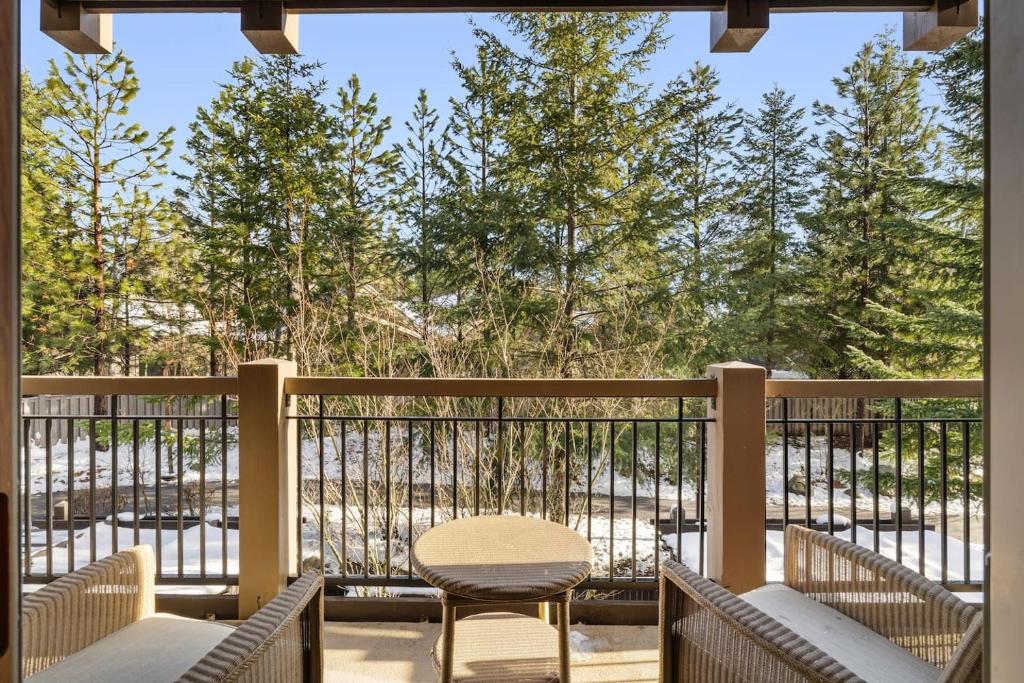 a balcony with a table and chairs and trees at 2038 Warm Winter Retreat - Perfect Lodge Room in Cle Elum