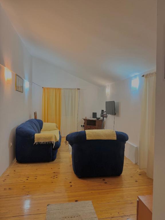 a living room with two couches and a table at Radovic Apartmani in Herceg-Novi
