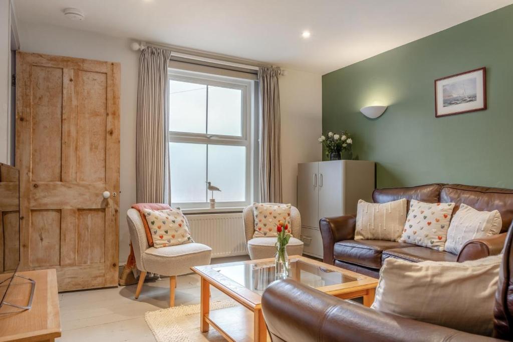 a living room with a couch and a table at 2 Bed in Bembridge oc-p34174 in Bembridge