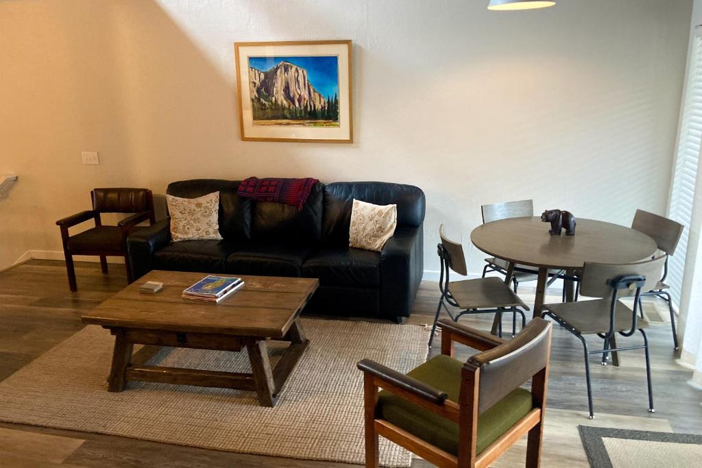 a living room with a couch and a table at The Cozy King in Kings Beach