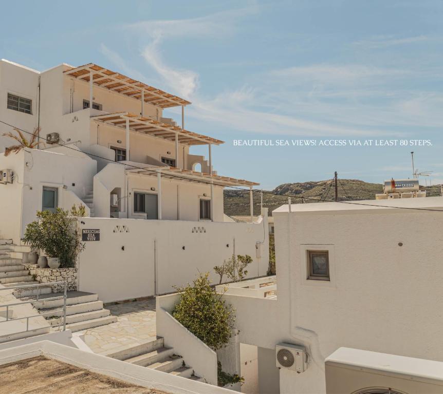 a view of a building with white at Merichas Sea View Suites in Kithnos