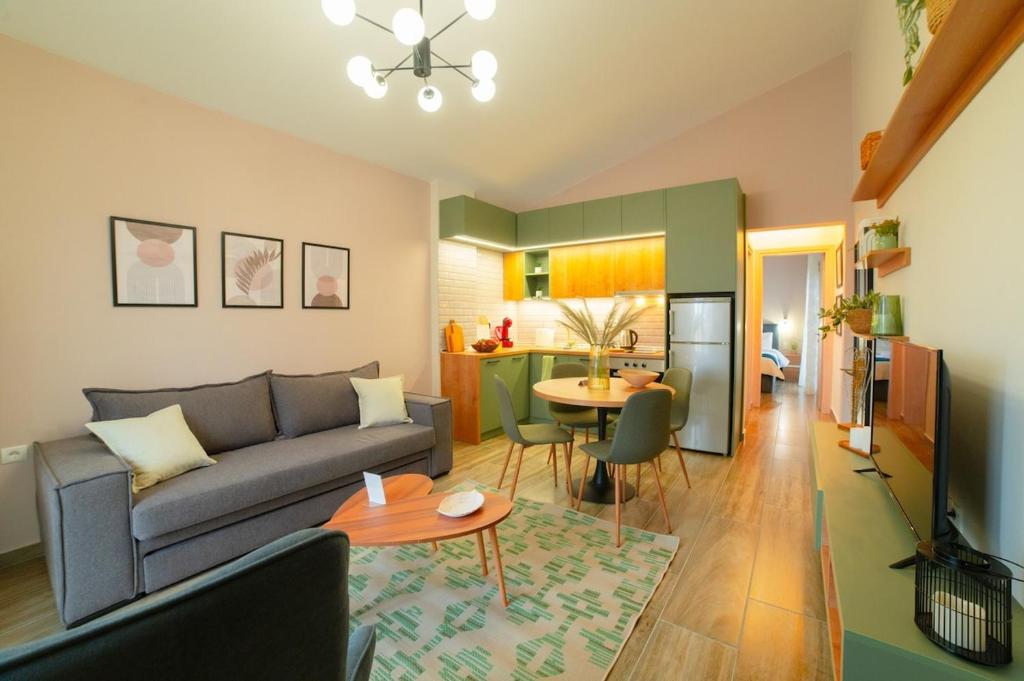 a living room with a couch and a table at Modern house! in Iráklia