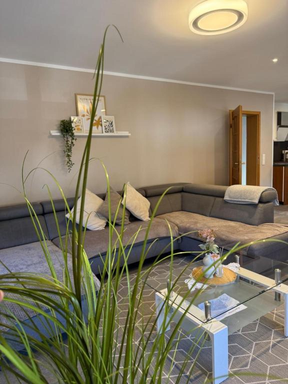 a living room with a couch and a table at Adiferienwohnung1 in Gerolstein