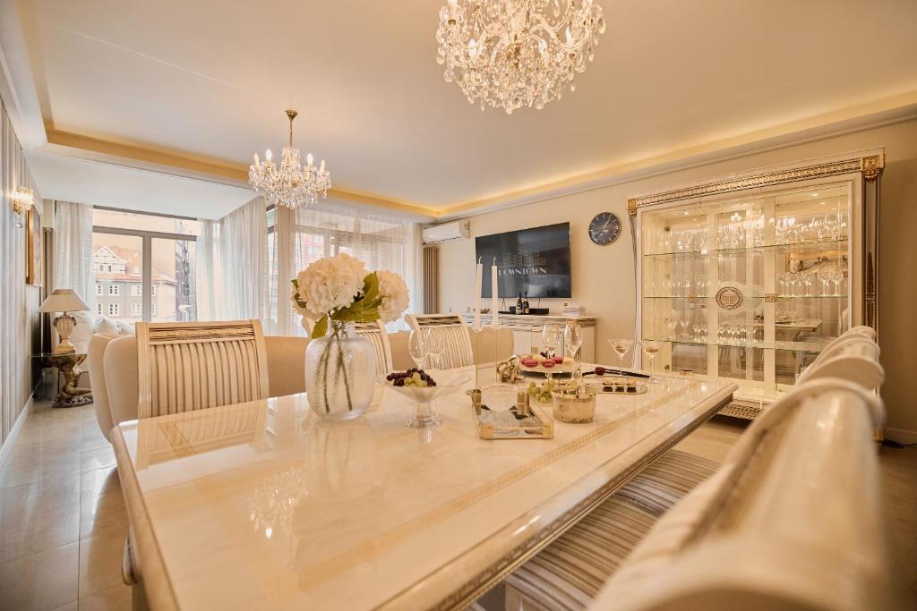 a large dining room with a table and chairs at Waterlane Riverside - SPA, Pool, Gym & Parking by Downtown Apartments in Gdańsk