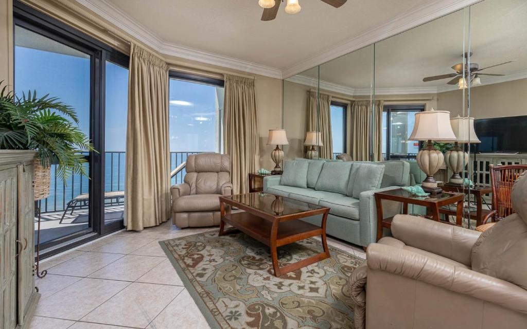 a living room with a view of the ocean at Phoenix VI 61509 in Orange Beach