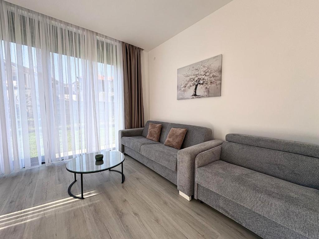 a living room with a couch and a table at Villa Maja in Trebinje