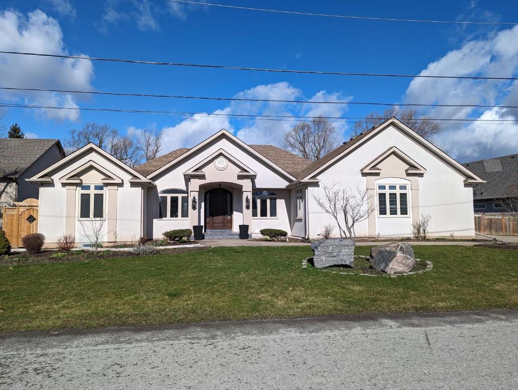 a large white house with at Picturesque Luxury Waterside Villa in Niagara Falls
