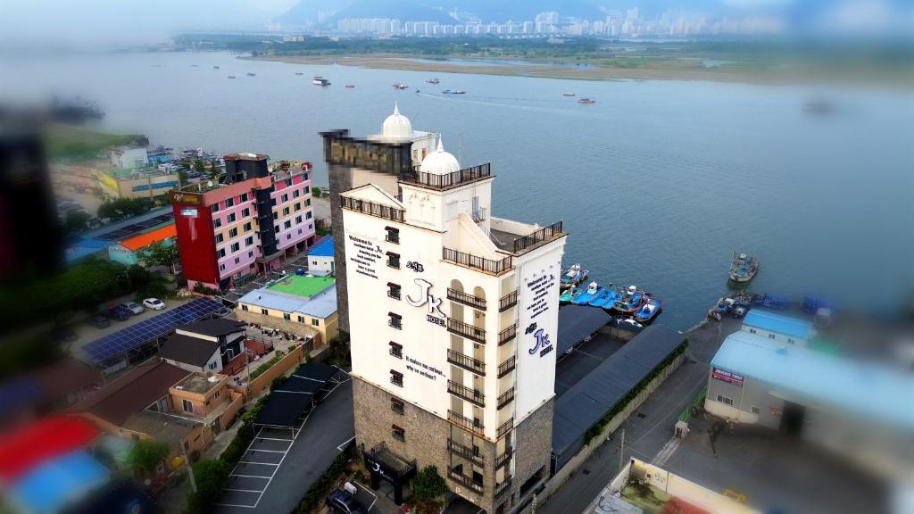 an aerial view of a building next to the water at JK Hotel in Busan