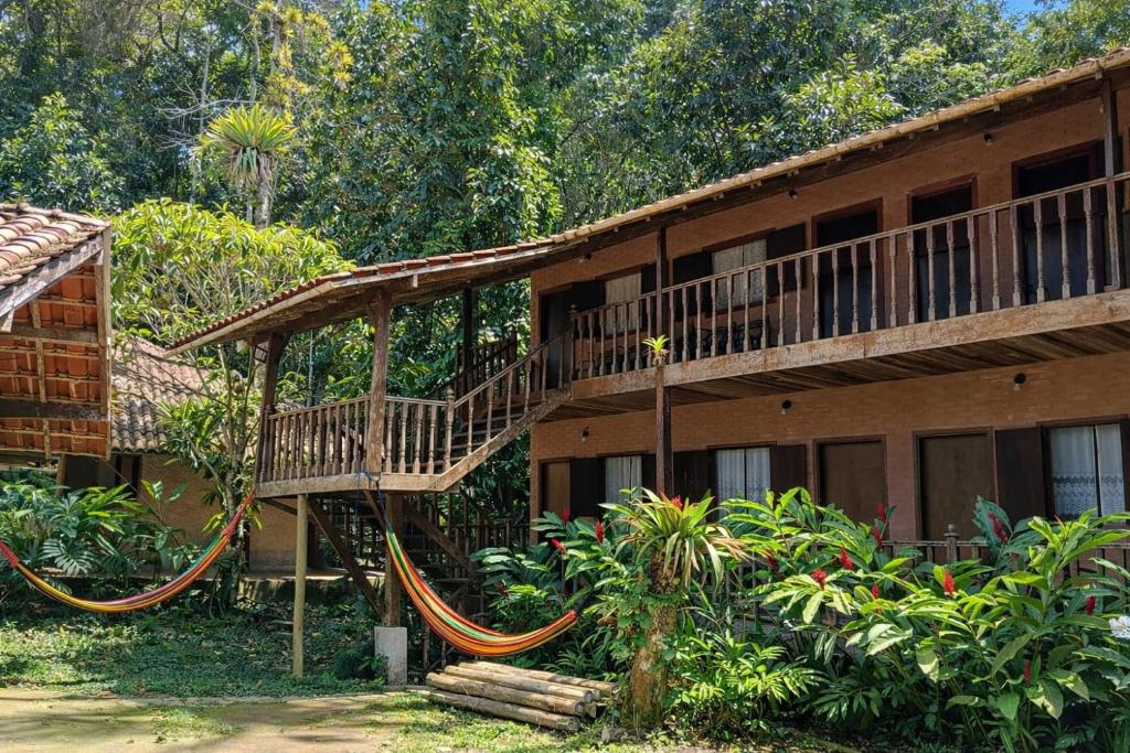a house with a slide in front of it at Pousada Mar Azul in Trindade