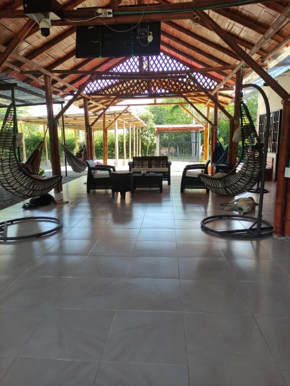 a patio with two hammocks in a pavilion at Cabañas Spacetatacoa in Villavieja