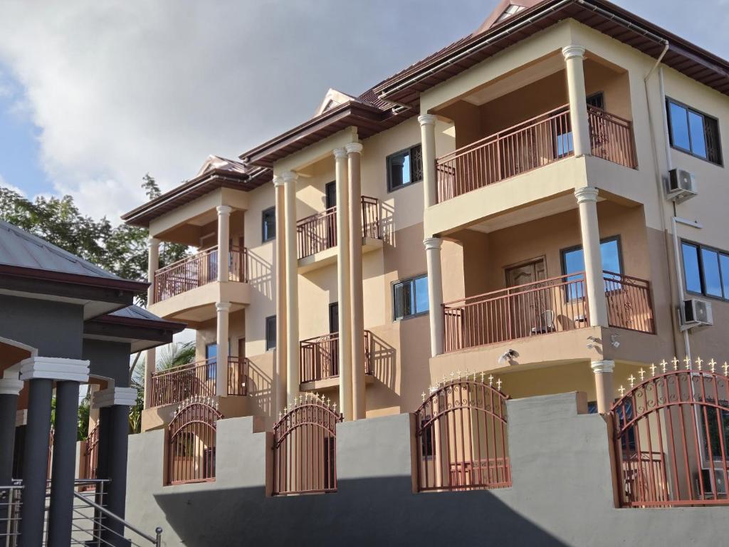 a building with balconies on the side of it at Grace View Villa in Trofwi