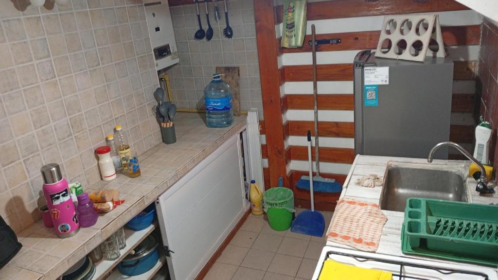 a kitchen with a sink and a counter top at Triplex waltito in San Clemente del Tuyu
