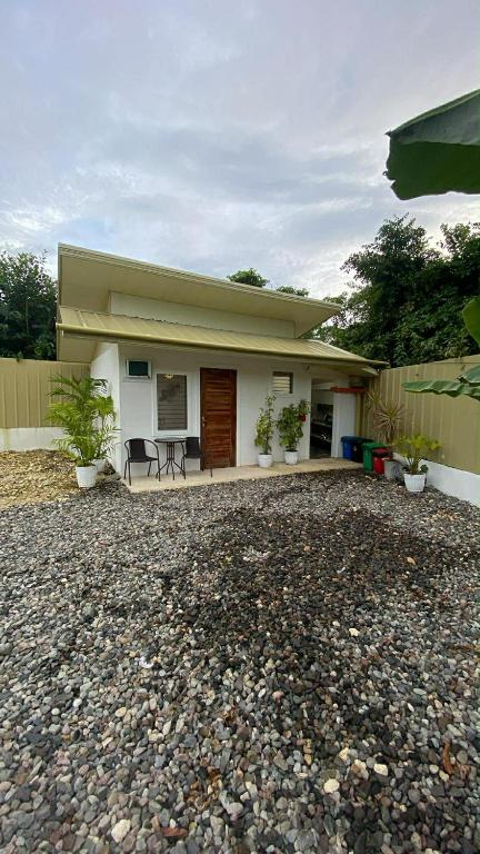 a house with a gravel yard in front of it at Eco Homes in Panglao Island