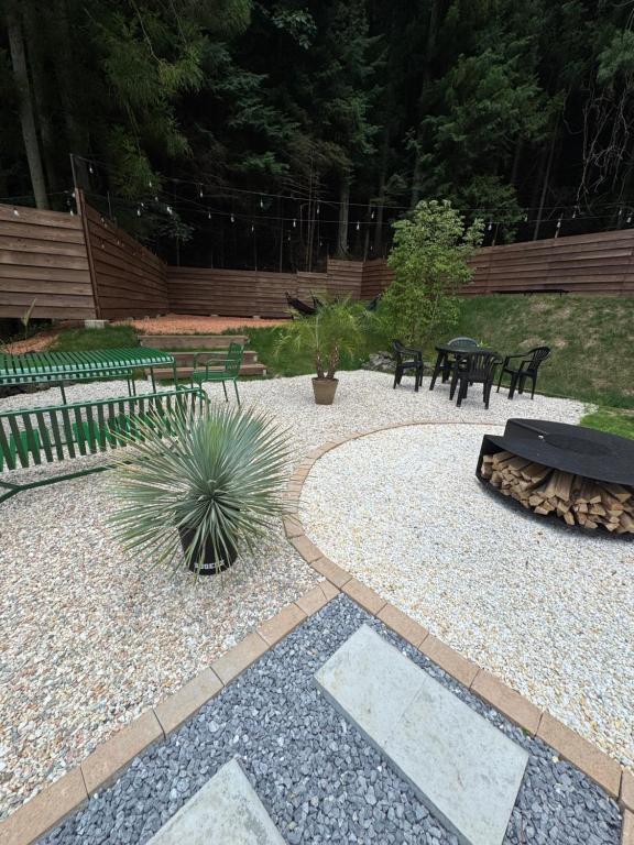 a patio with two benches and a table and a sidx sidx sidx sidx at SUGEEZ motel in Fujikawaguchiko