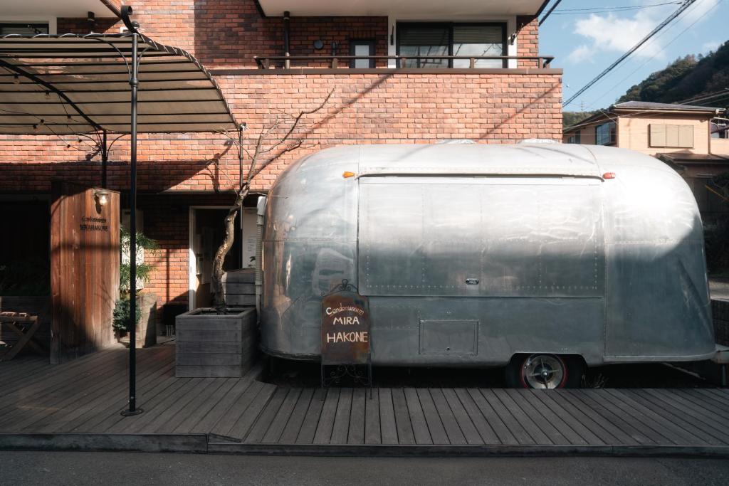 a silver trailer parked in front of a house at Condominium MIRAHAKONE in Hakone