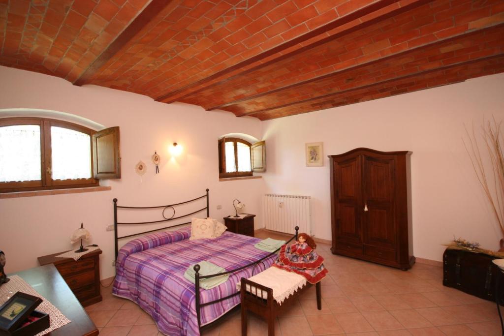 Postel nebo postele na pokoji v ubytování Pienza by PosarelliVillas