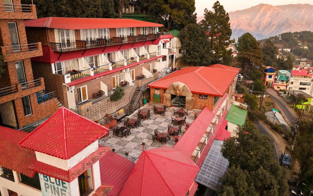 an aerial view of a building with red roofs at Blue Pine Resort in Lansdowne