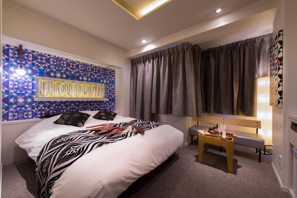 Postel nebo postele na pokoji v ubytování Hotel COREST (Adult Only)