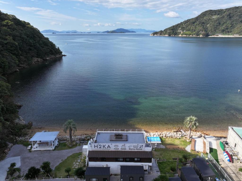 a view of a body of water with a beach at ALY HOTEL See Sea Son in Kure