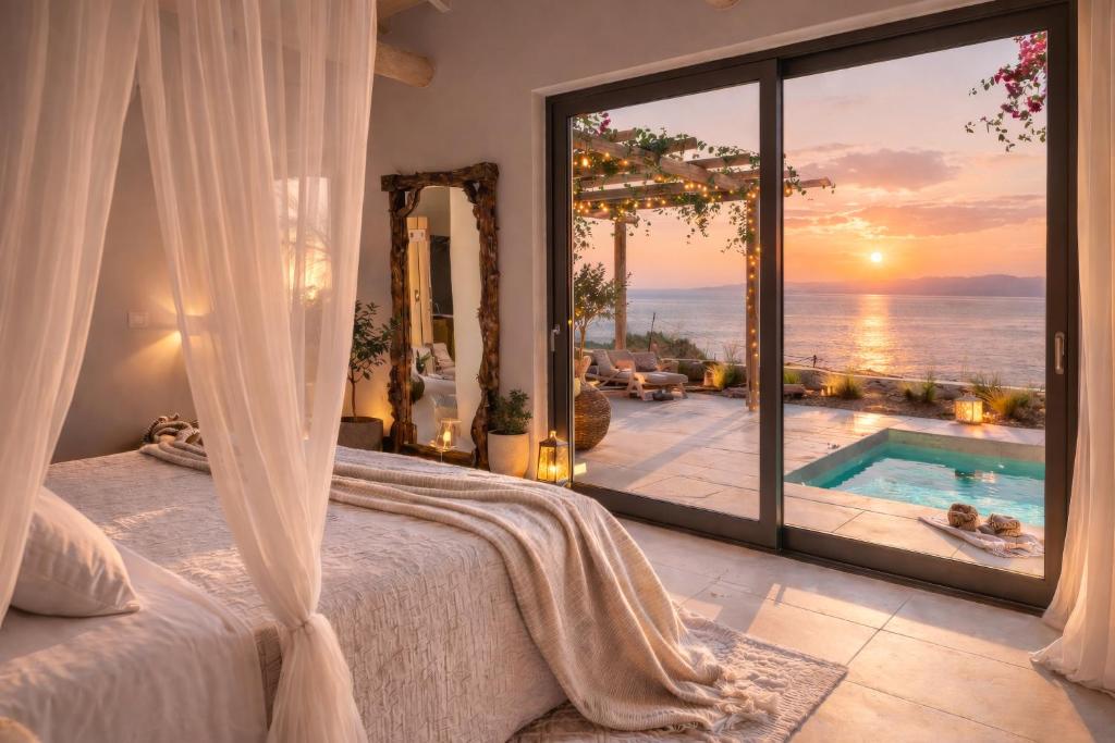 a bedroom with a bed and a view of the ocean at Spathes Luxury Private Pool Villa with Sea View in Kefalonia in Ratzaklíon