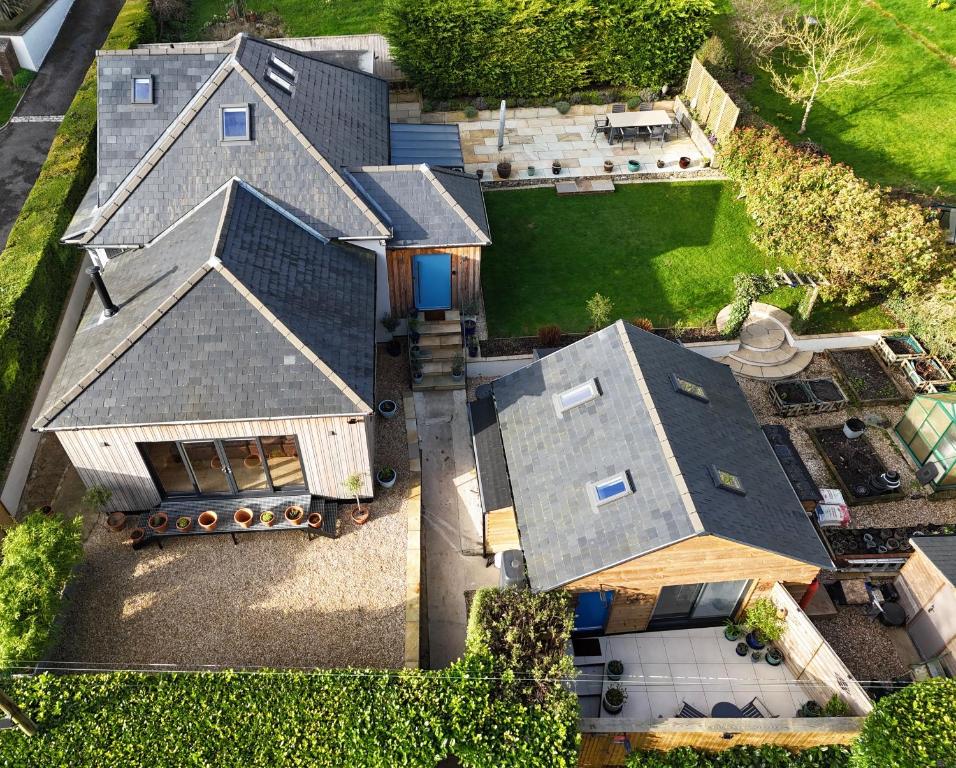an aerial view of a house with a roof at Cranbrook on the river lym walk in Uplyme in Uplyme