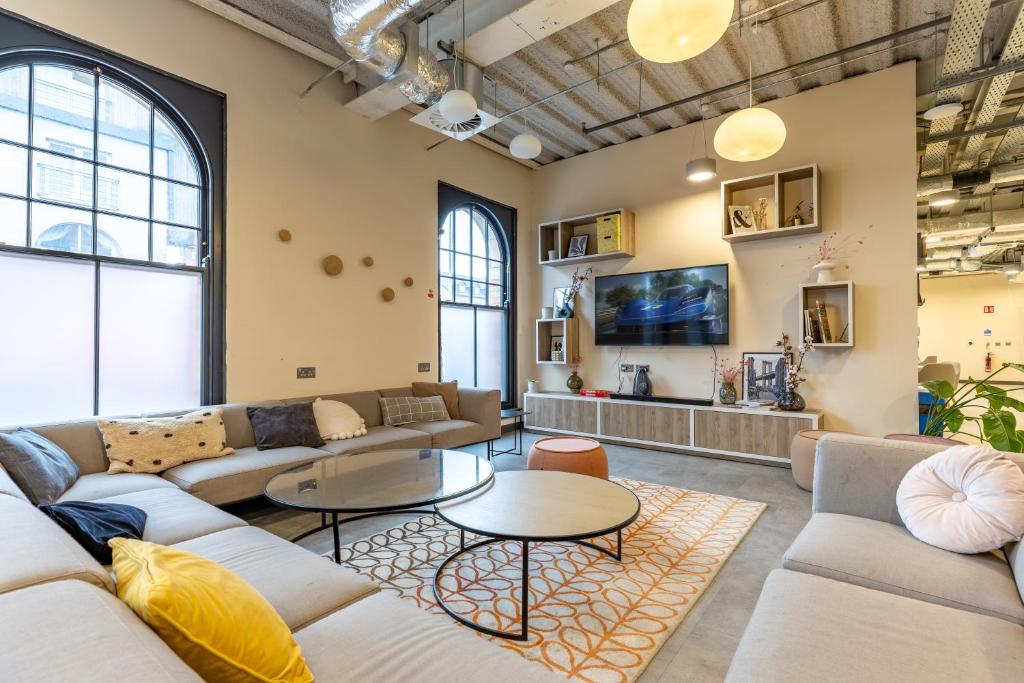 a large living room with couches and tables at Argyl - Broga House Central Cork Accommodation in Cork