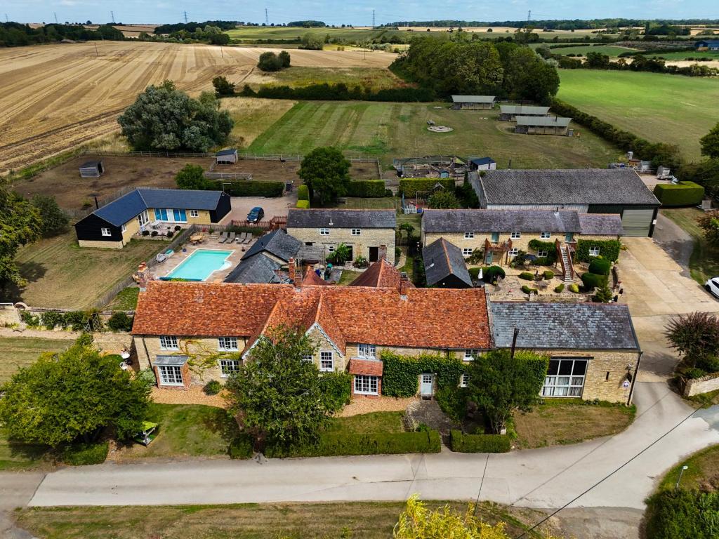an aerial view of a large house with a yard at The Old Stone Barn in Warrington
