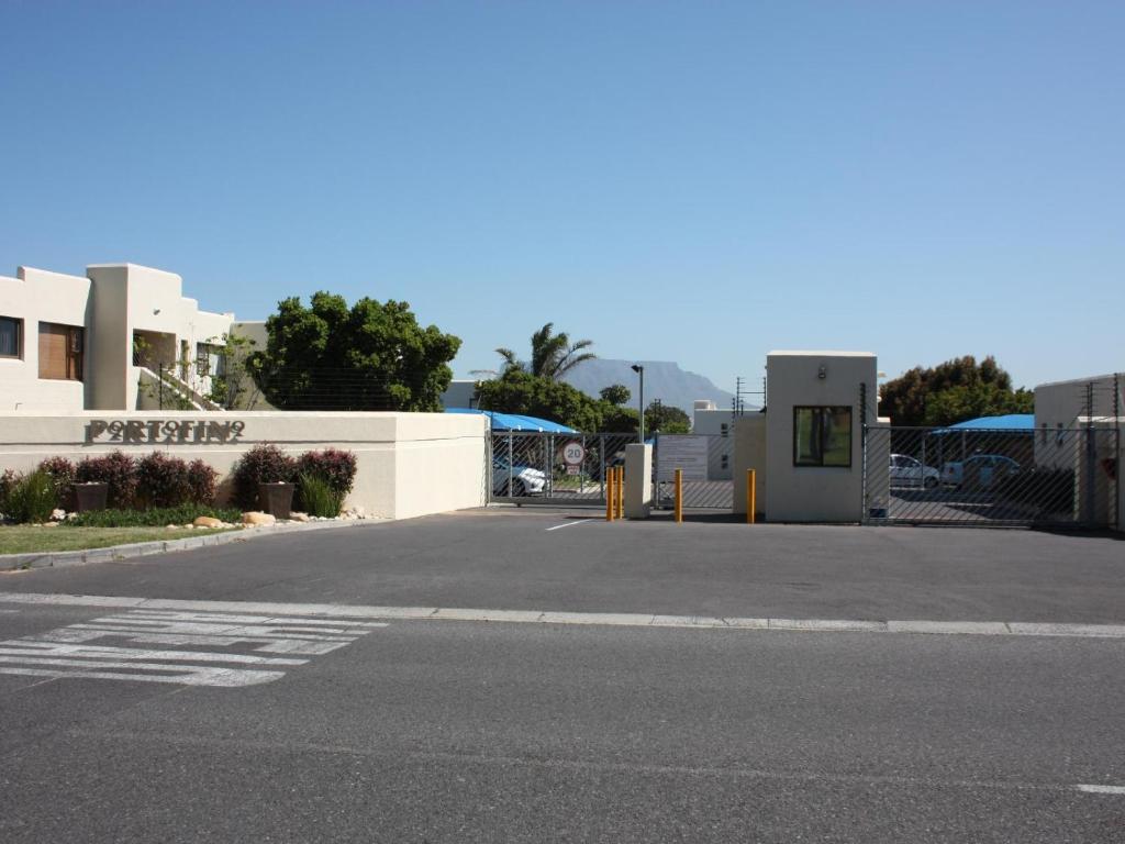 an empty parking lot in front of a building at Amies Self-Catering Apartments in Panorama