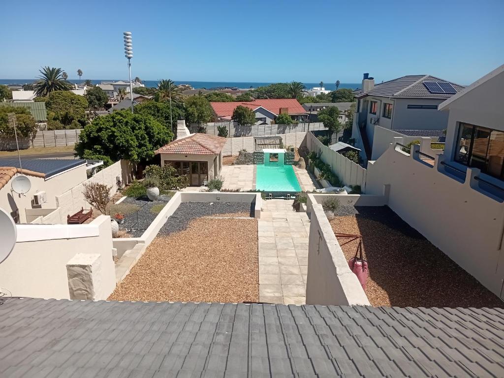a view of a backyard with a swimming pool at Ocean Glimpse in Cape Town