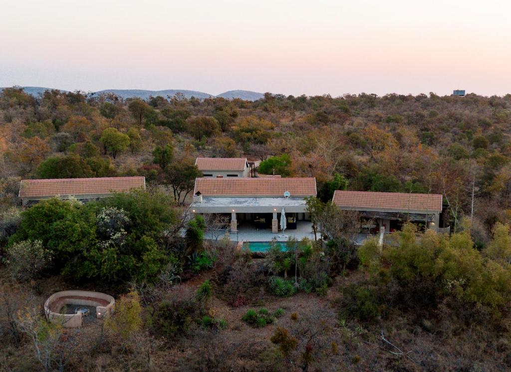 an aerial view of a house in the woods at Elements Private Golf Villa 295 in Warmbaths