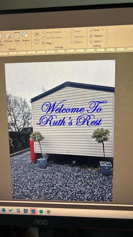 a computer screen with a picture of a garage at Ruth's Rest Shropshire Country Retreat with private Hot Tub & Views countryside in Shrewsbury