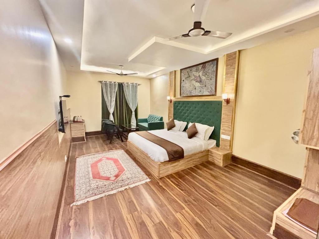 a bedroom with a bed in a room at Krimzon Manor in Srinagar