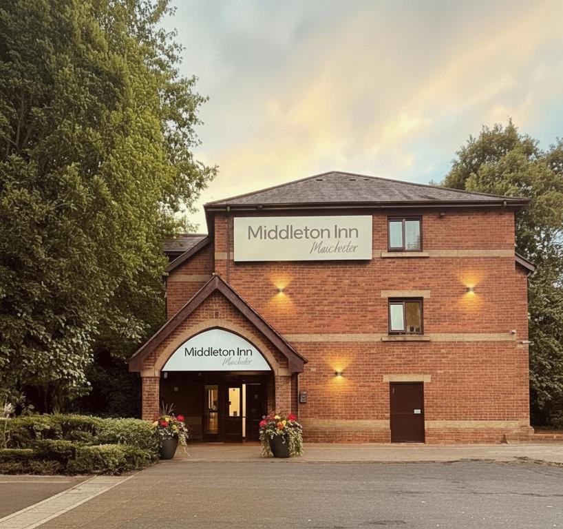 a brick building with a sign that reads midestead inn at Middleton Inn, Manchester in Manchester