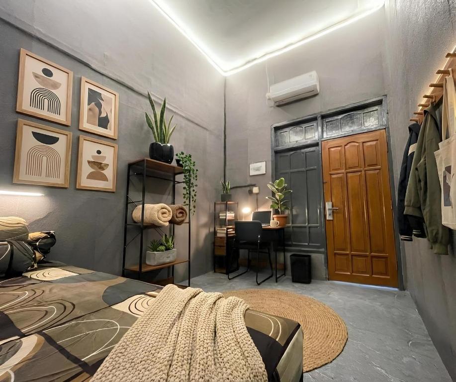 a bedroom with a bed and a desk in a room at Residence 168 in Gununganjar