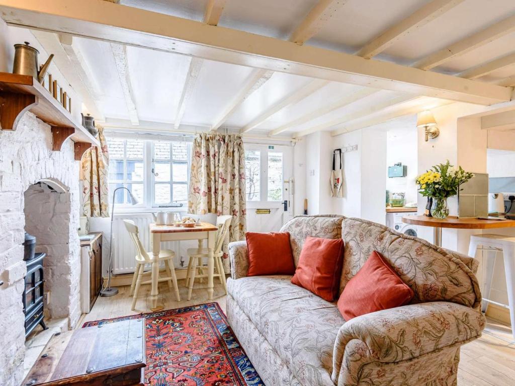 a living room with a couch and a table at 1 Bed in Presteigne oc-53667 in Presteigne