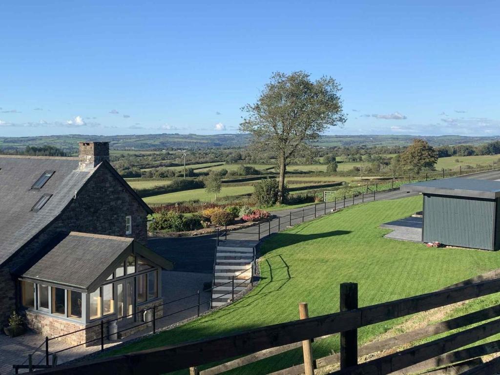 an aerial view of a house with a fence at 4 Bed in Llandysul oc-89422 in Cwm-pengraig