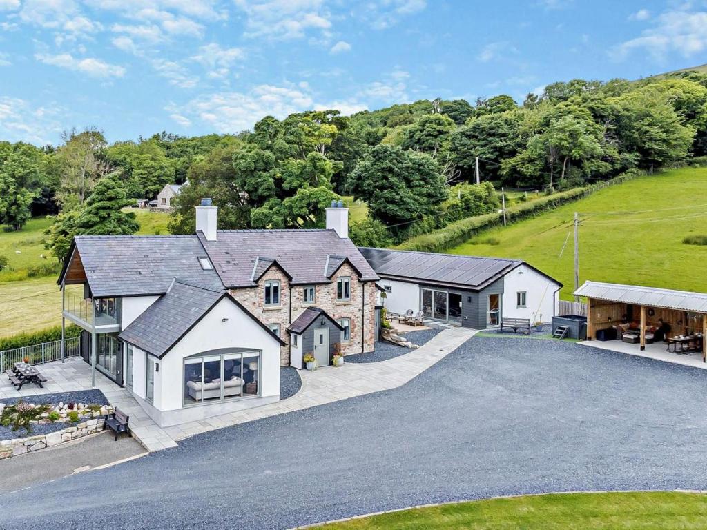 an aerial view of a house with a driveway at 5 Bed in Denbigh oc-86009 in Llandyrnog