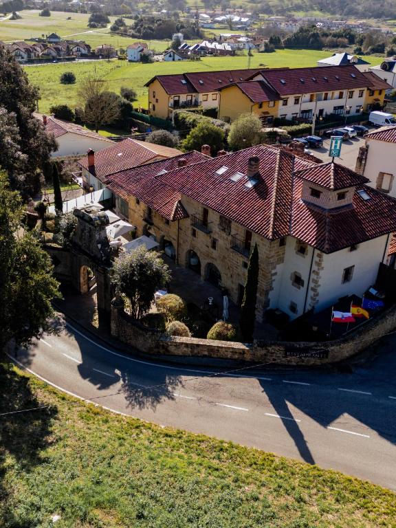 an aerial view of a house with a roof at Palacio de Arce in Puente Arce