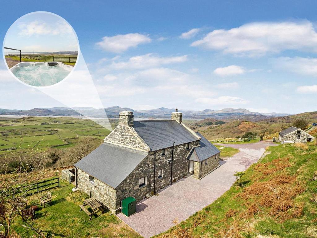 an image of a stone house on a hill at 6 Bed in Harlech oc-91546 in Harlech
