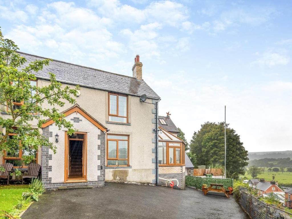 an exterior view of a house with a parking lot at 3 Bed in Corwen oc-90459 in Corwen