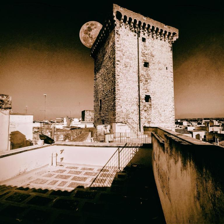 a clock tower with a moon on top of it at Luna Normanna in Rutigliano