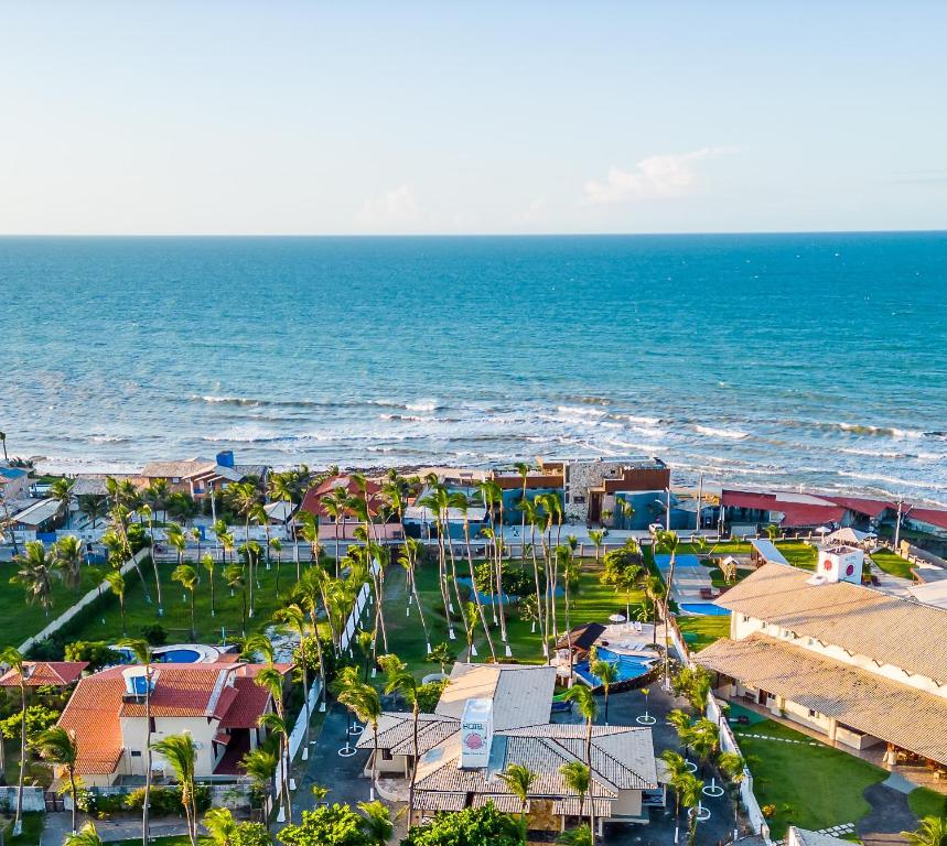 an aerial view of a resort next to the ocean at Sunset Beach Villas in Taíba