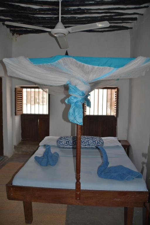 Postel nebo postele na pokoji v ubytování Kiponda B&B