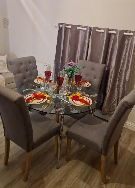 a dining room table with glasses of red wine at Banbury causeway in Banbury