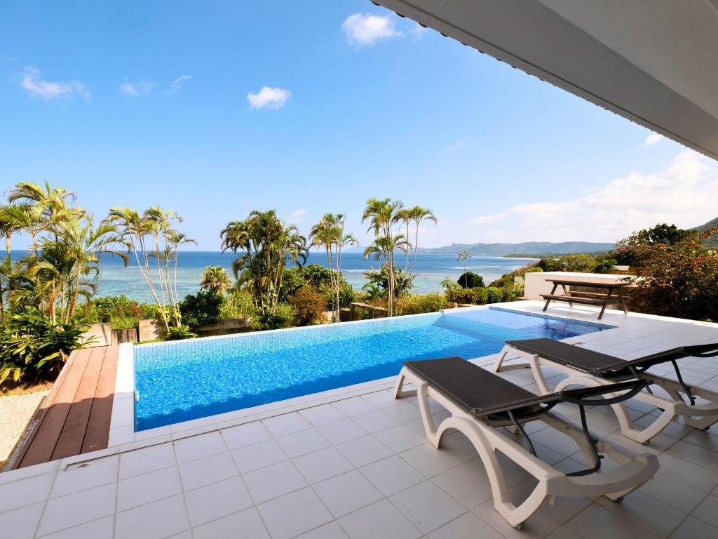 a view of a swimming pool from a villa at YUTO Ishigakijima in Ishigaki Island