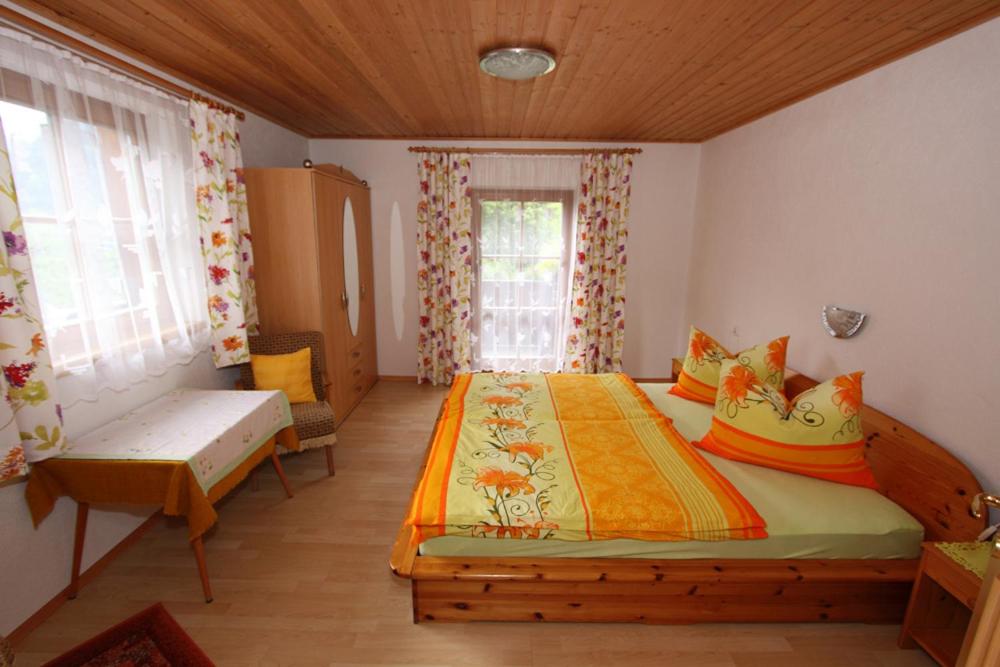 A bed or beds in a room at Plattnerhof
