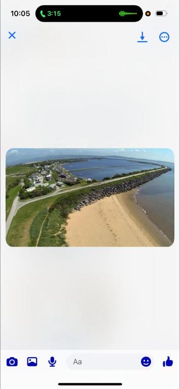 a screenshot of a cell phone with a picture of a beach at Trailer by the sea in Millom