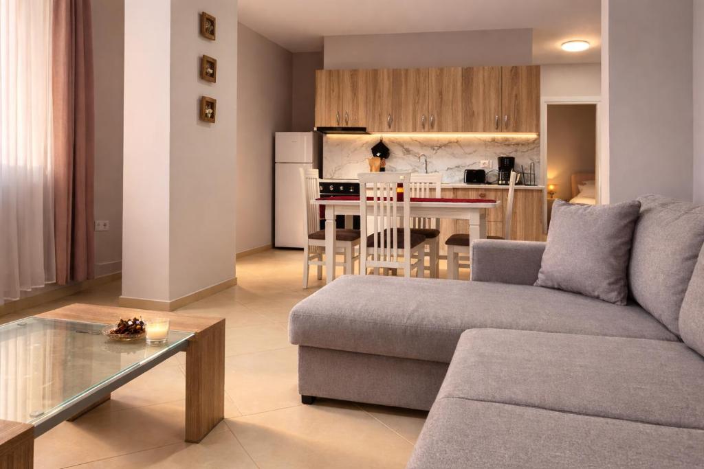 a living room with a couch and a table at Dahlila's Home near Lake Ohrid in Pogradec