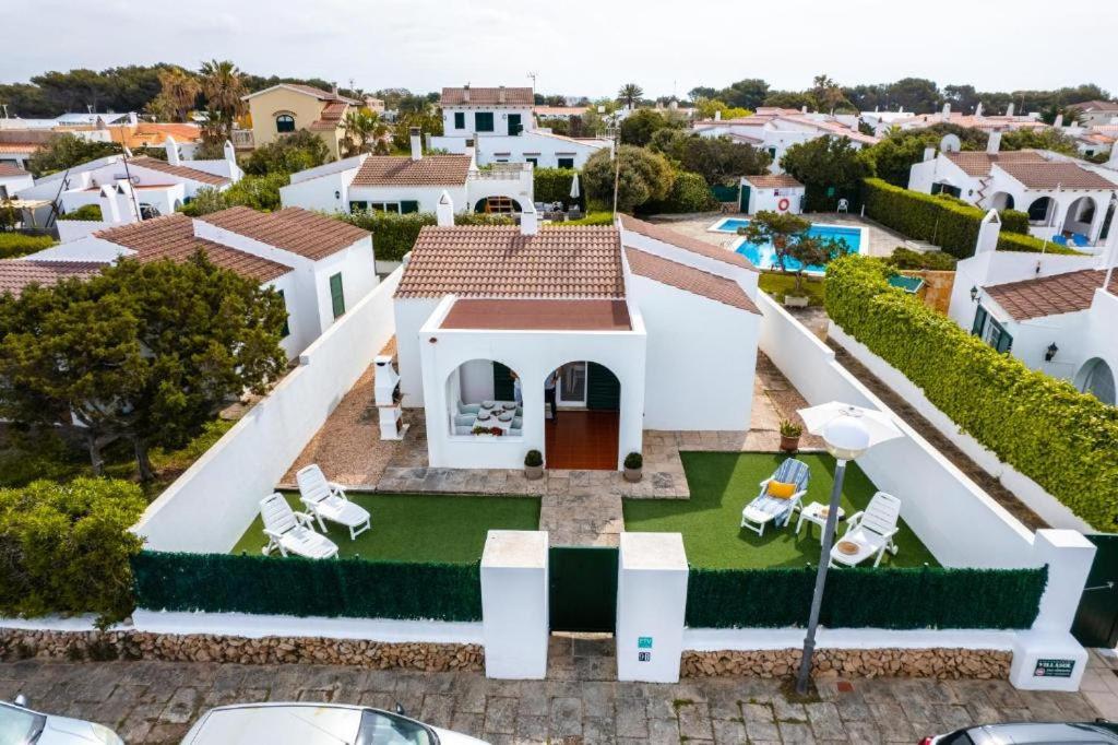 an aerial view of a house with a yard at Villa Audrey in Cala en Bosc