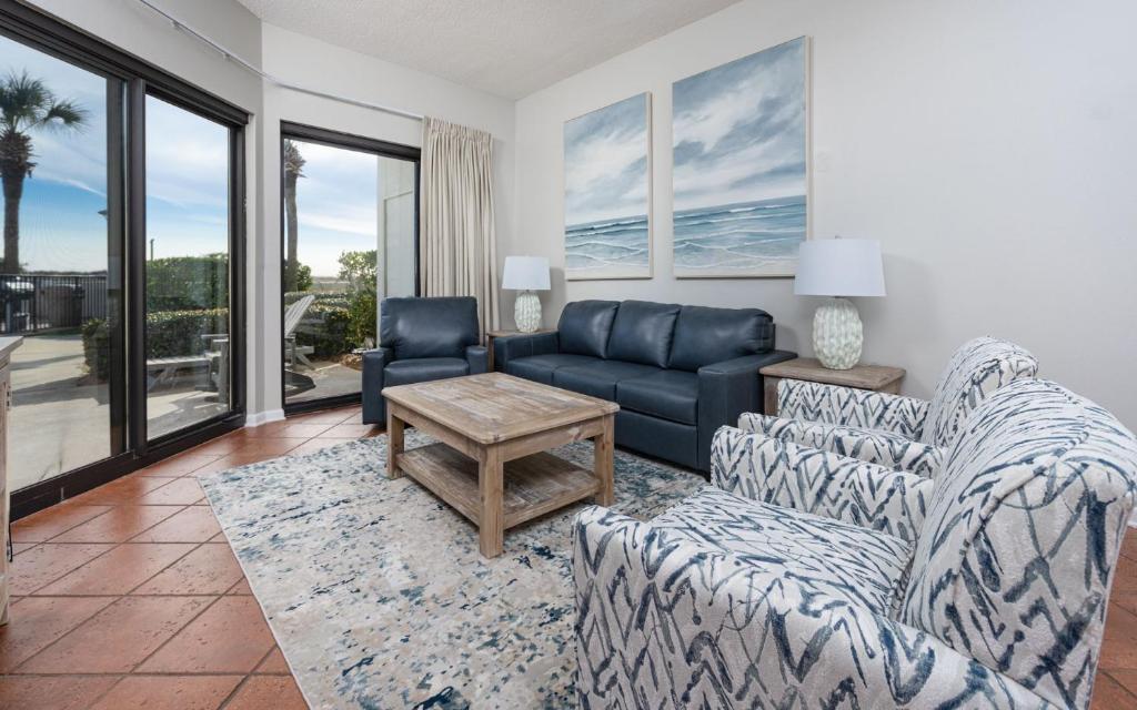 a living room with a couch and a table at Phoenix VI 6004 in Orange Beach